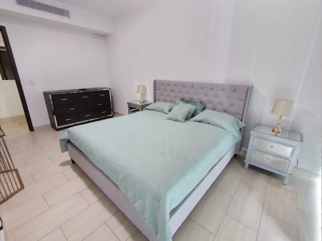 Modern kitchen granite counters dark wood cabinets stainless steel appliances PH Grand Tower Punta Pacifica Panama