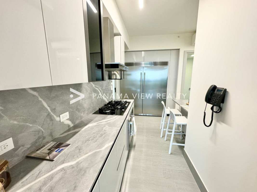 Marble-finished bathroom with glass shower modern fixtures The Ivy Santa Maria Panama