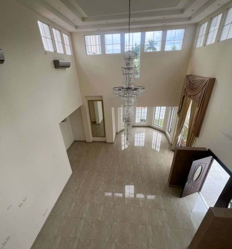 Contemporary kitchen with island, granite counters, double oven in Altos del Golf Panama house rental