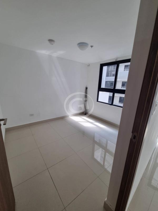 Bedroom with large window, tile floors, and walk-in closet PH Worldwide Plaza Panama