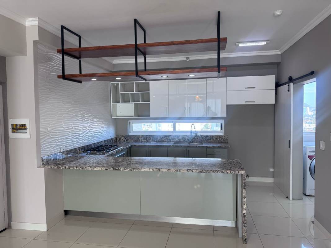 Modern living room with large window, AC, pendant light, tile floors PH Nautica Panama