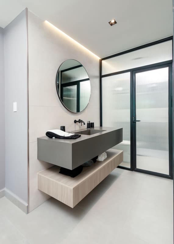 Minimalist vanity with backlit mirror in Uptown Marbella apartment Panama