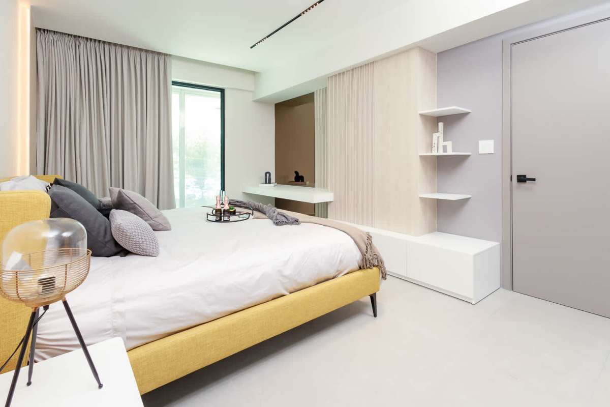 Sunny modern bedroom with minimalist decor Uptown Marbella condominium Panama