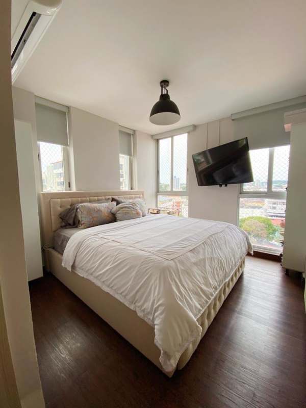 Bedroom with modern design, wood flooring, large window and cityscape view El Carmen Panama