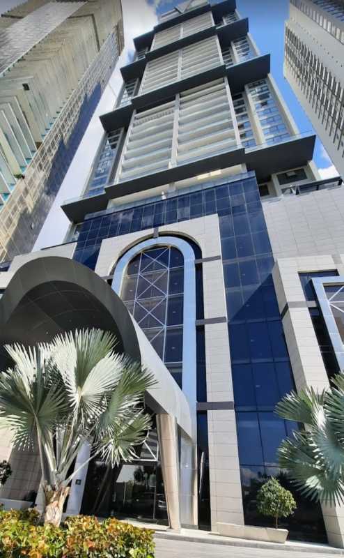 Luxury skyscraper tower of Empire Residences Santa Maria surrounded by gardens and golf