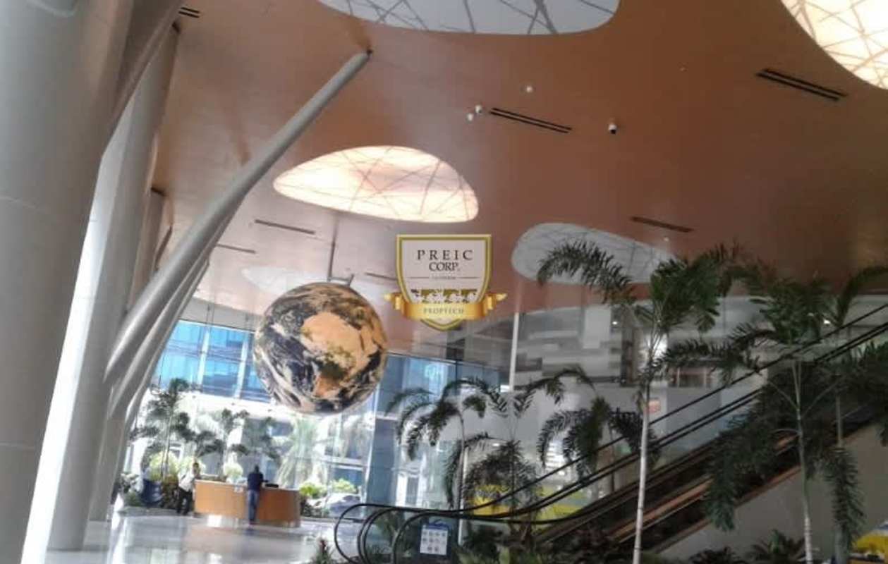 Double height lobby with rotating globe sculpture in Costa del Este Business Tower Panama