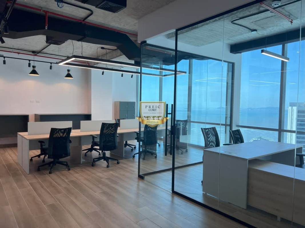 Modern office space with large windows, ocean and skyline view at Costa del Este Business Tower