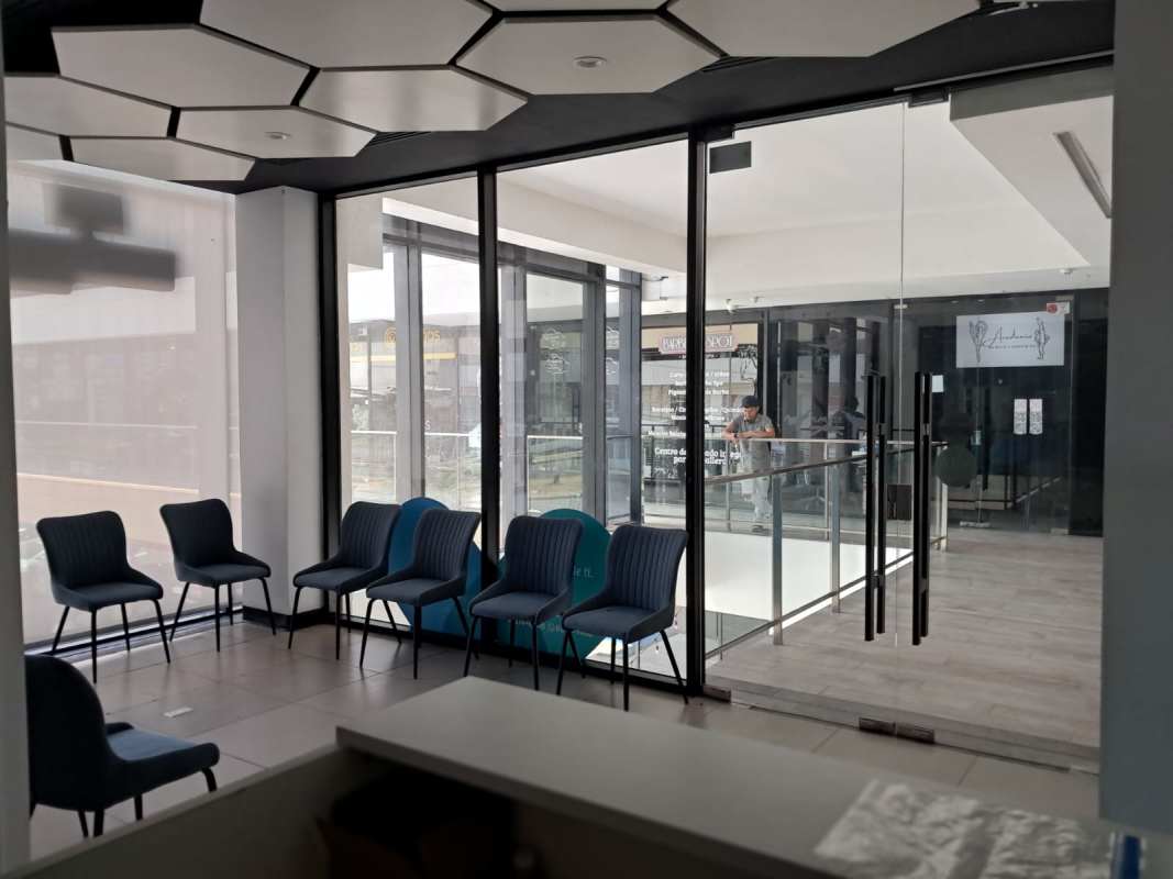 Reception lobby with glass entrance and signage in Plaza Liberty commercial space Panama City