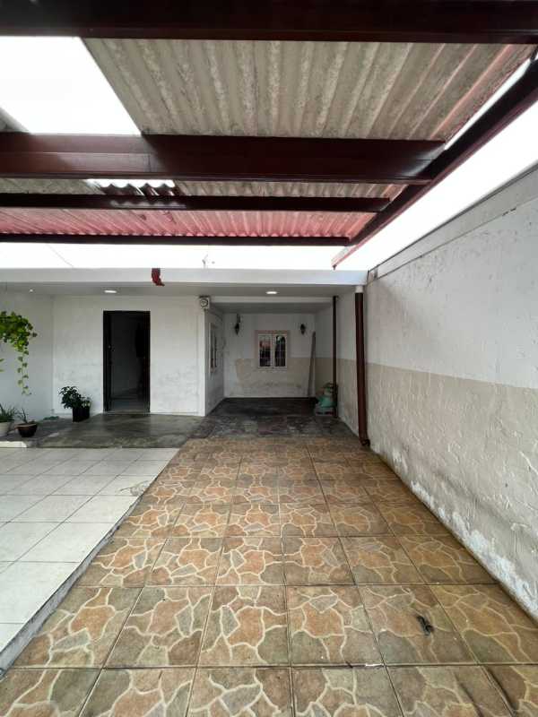 Kitchen with granite counter, tile backsplash, and appliances in Chanis house