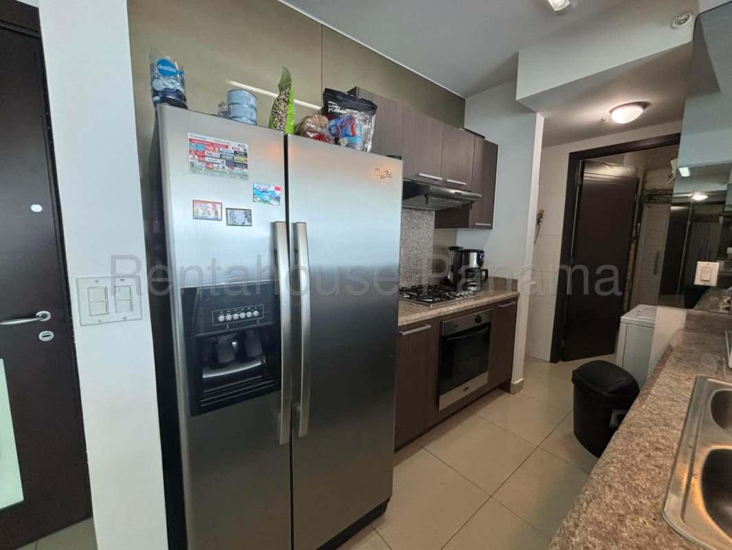 Bright living area with access to balcony and city skyline views at PH Costa del Este Panama