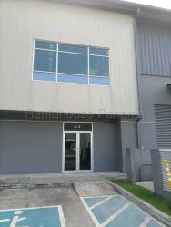 Wide driveway and parking spaces outside warehouse at Panama Pacifico