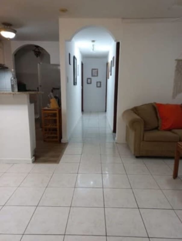 Living room with archways and tile floors at PH Albrook Gardens Clayton Panama City