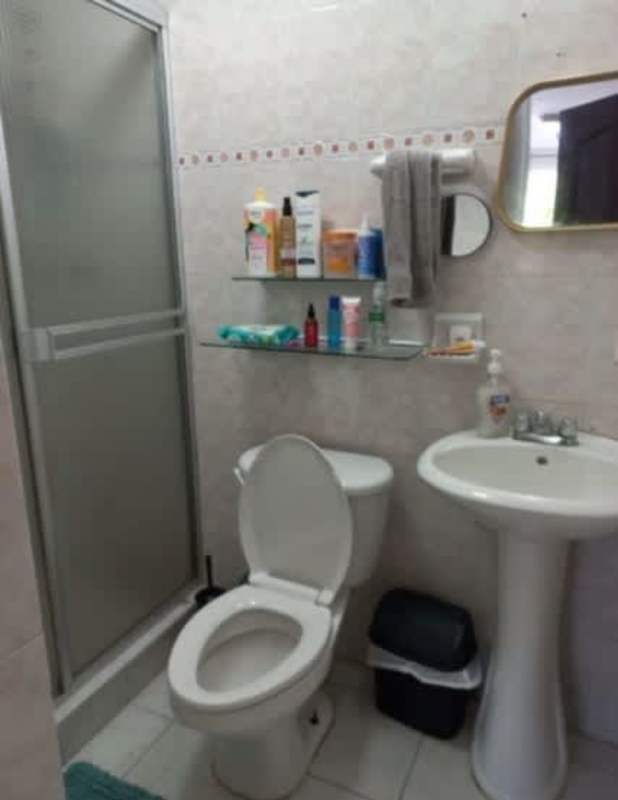 Compact bathroom with glass shower, pedestal sink PH Albrook Gardens Clayton Panama City