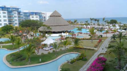 Private balcony with resort and giant lagoon pool view at Nikki Residences Playa Blanca Panama