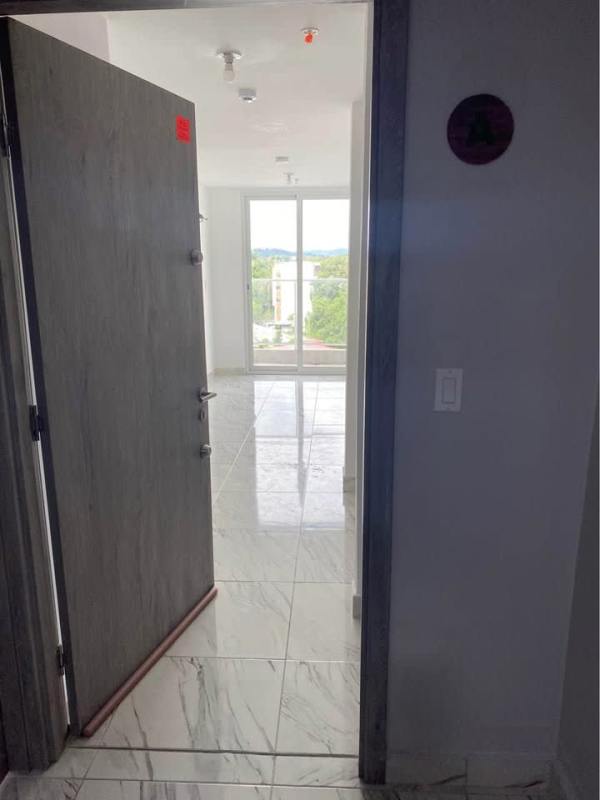 Entrance area with marble tile and balcony access PH Botánico Panama apartment