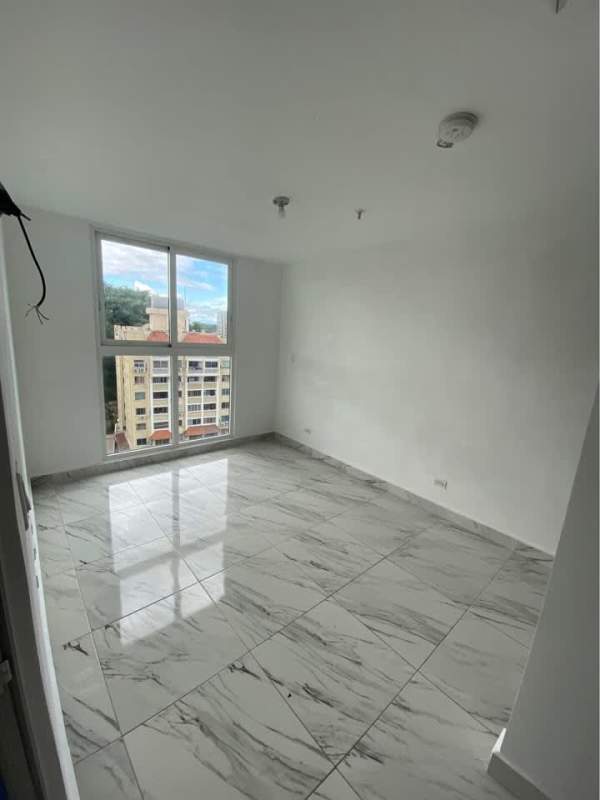 Interior hallway with marble floor and apartment entry doors PH Botánico Panama