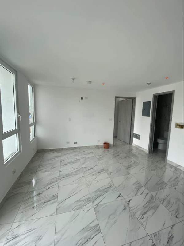 Open unfurnished living room with marble floor and large windows PH Botánico Bella Vista