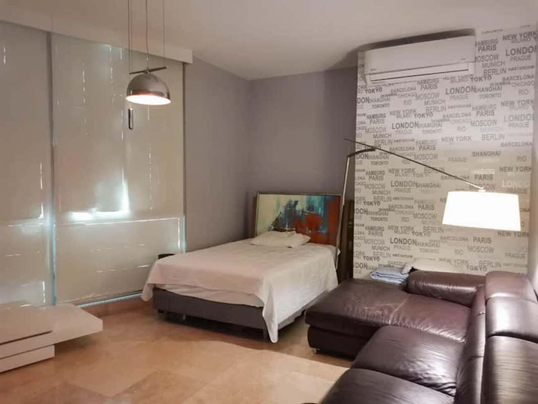 Elegant living dining area with marble flooring and floor-to-ceiling windows at Ocean Club Punta Pacifica Panama