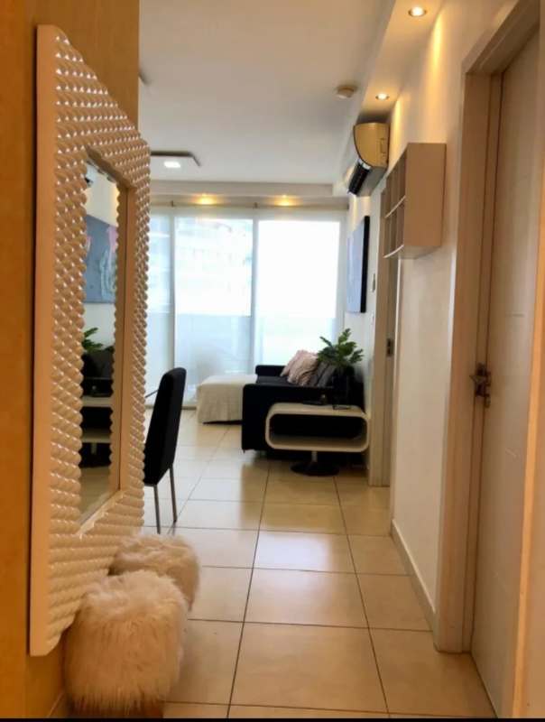 Modern living room with floor-to-ceiling windows overlooking Pacific Ocean in PH Oasis Punta Pacifica Panama City