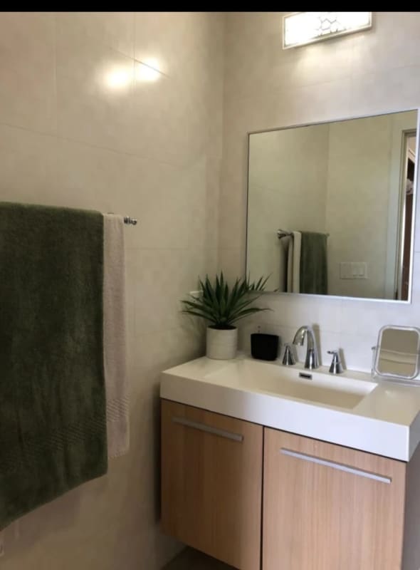 Minimalist modern bathroom with vanity and mirror at PH Oasis Punta Pacifica Panama