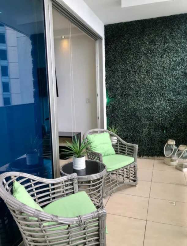 Modern balcony with vertical garden, wicker furniture, ocean views at PH Oasis Punta Pacifica Panama
