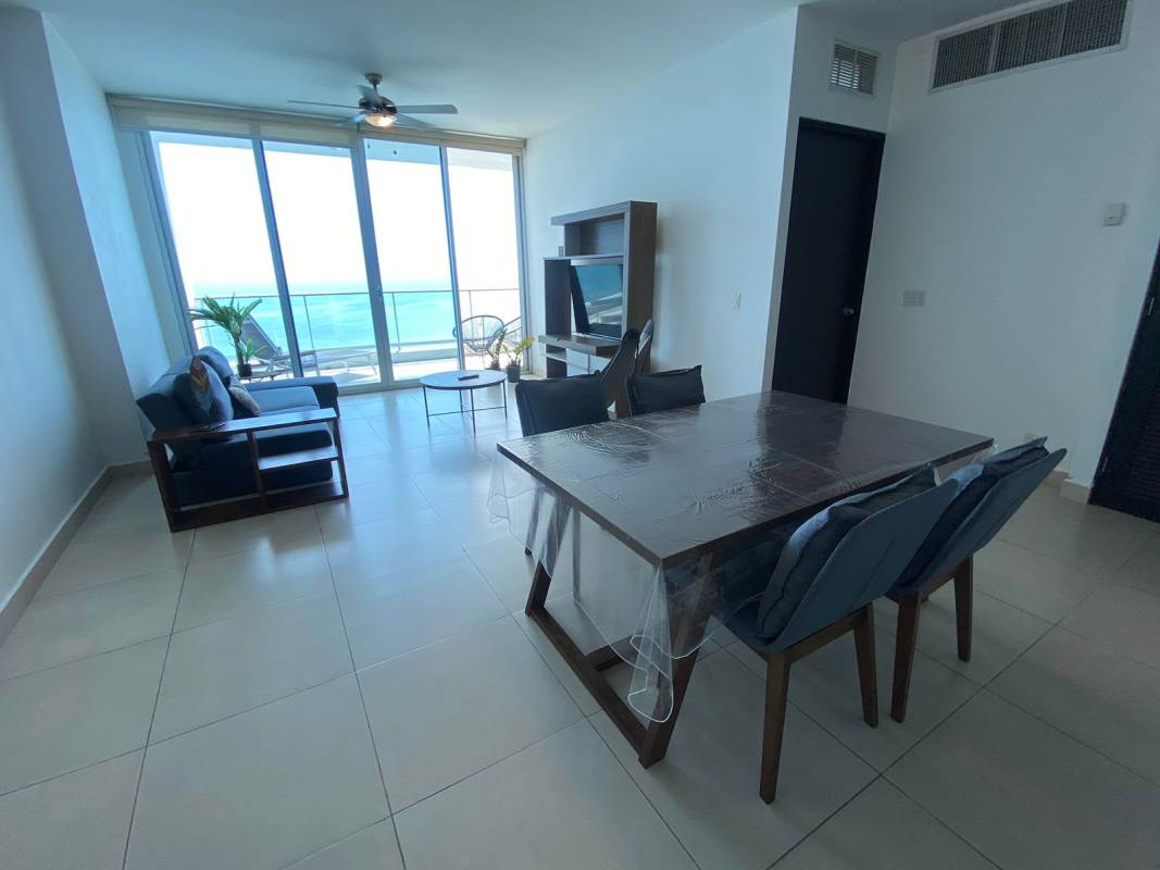 Modern furnished living room with floor-to-ceiling windows and ocean views in PH Destiny Tower Panama