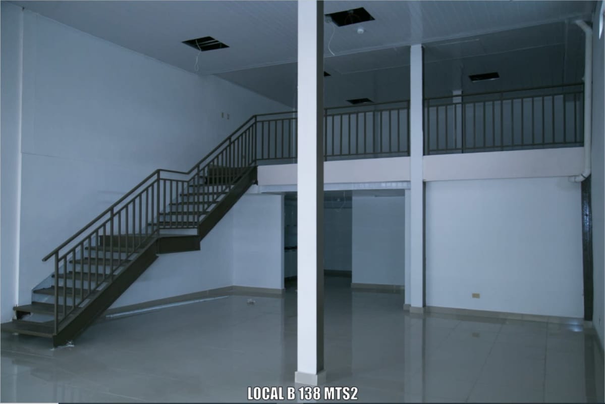 Two-story commercial unit with metal railings, tiled floor, and open space in San Francisco Panama