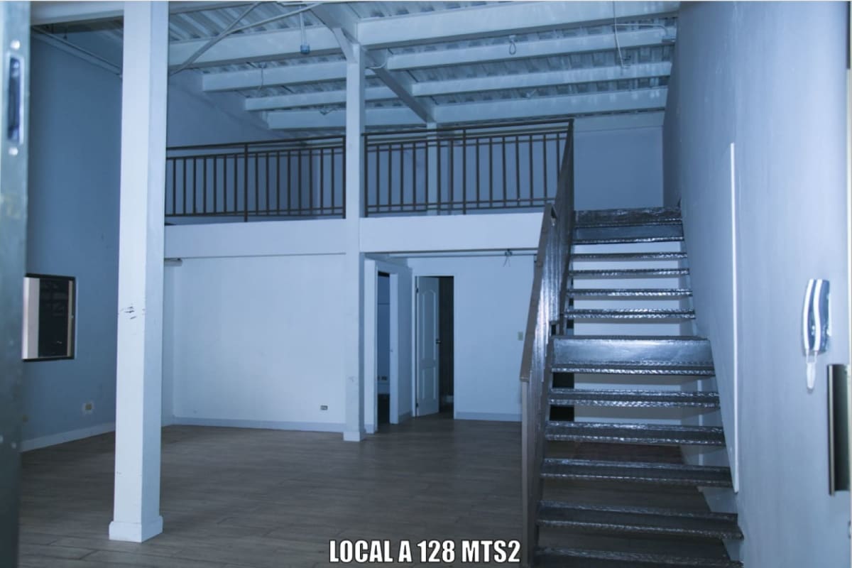 Interior commercial space with mezzanine and metal stairs ideal for urban business setup Panama
