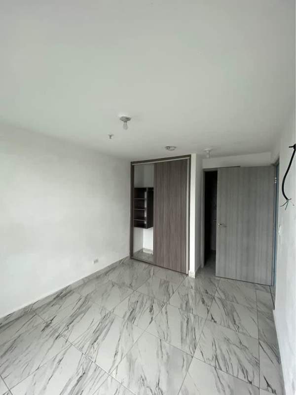 Bedroom featuring built-in closet, marble tiles PH Botanico Bella Vista Panama