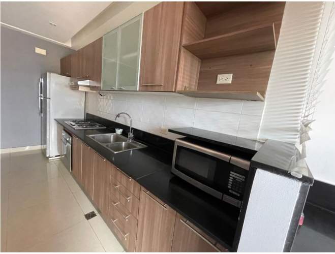 Granite countertops, stainless steel appliances and ample storage kitchen in PH Infinity San Francisco Panama