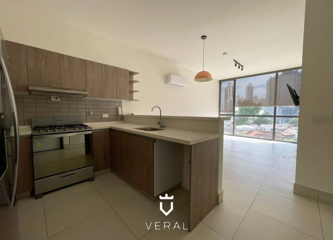 Kitchen with wood cabinetry, breakfast bar in PH Coco Place Coco del Mar Panama