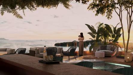 Rooftop terrace with ocean view, plunge pool, lounge seating and tropical plants at Playa Bonita Residence