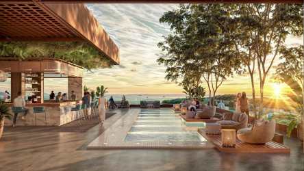 Infinity pool with panoramic ocean sunset views, outdoor lounge area and palm trees in Playa Bonita Panama