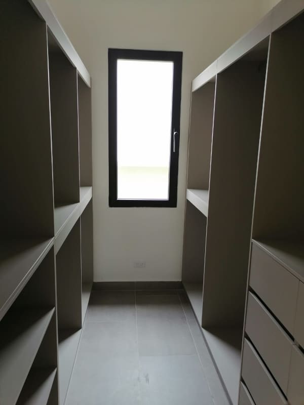 Modern bathroom with premium tiles glass shower enclosure in Altos de Panamá house