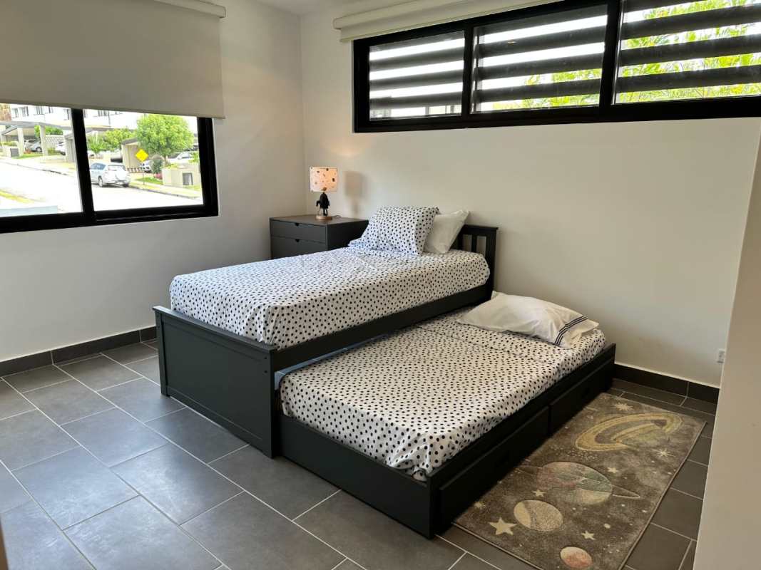 Minimalist kitchen island design with custom cabinets in Altos de Panamá house