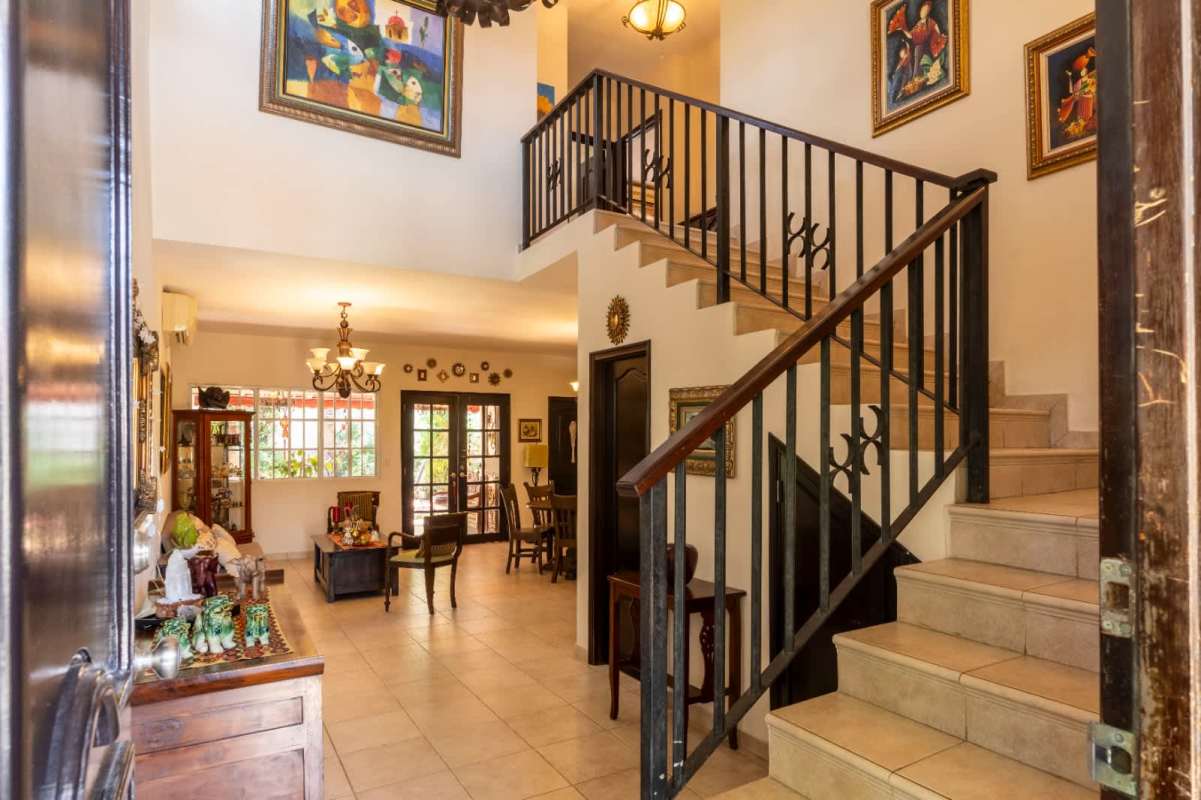 Foyer with staircase artwork chandelier traditional decor Bosque de Cibeles Panama City
