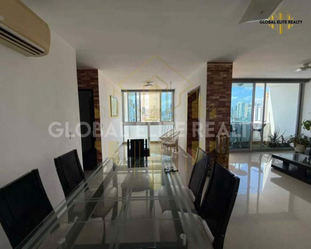 Modern dining area with access to balcony and city skyline, San Francisco district Panama