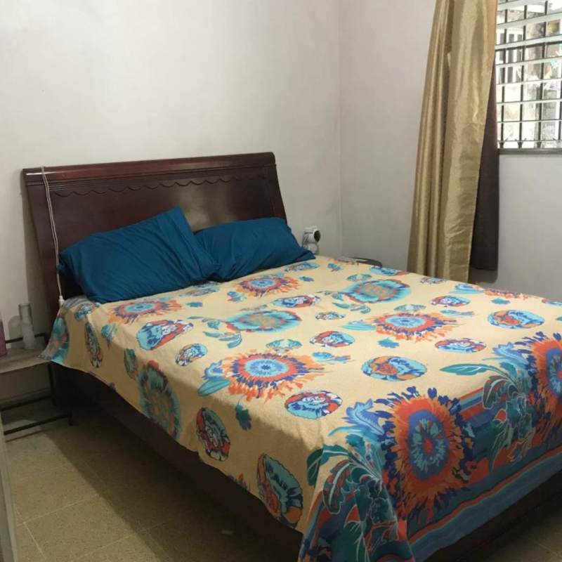 Covered outdoor patio with plants secure walls in Villa Belén Tocumen Panama house