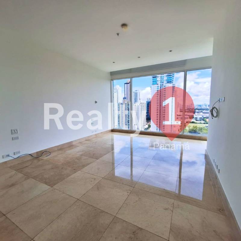 Contemporary kitchen with large refrigerator, granite island, built-in oven and bright windows in PH Aria Costa del Este Panama