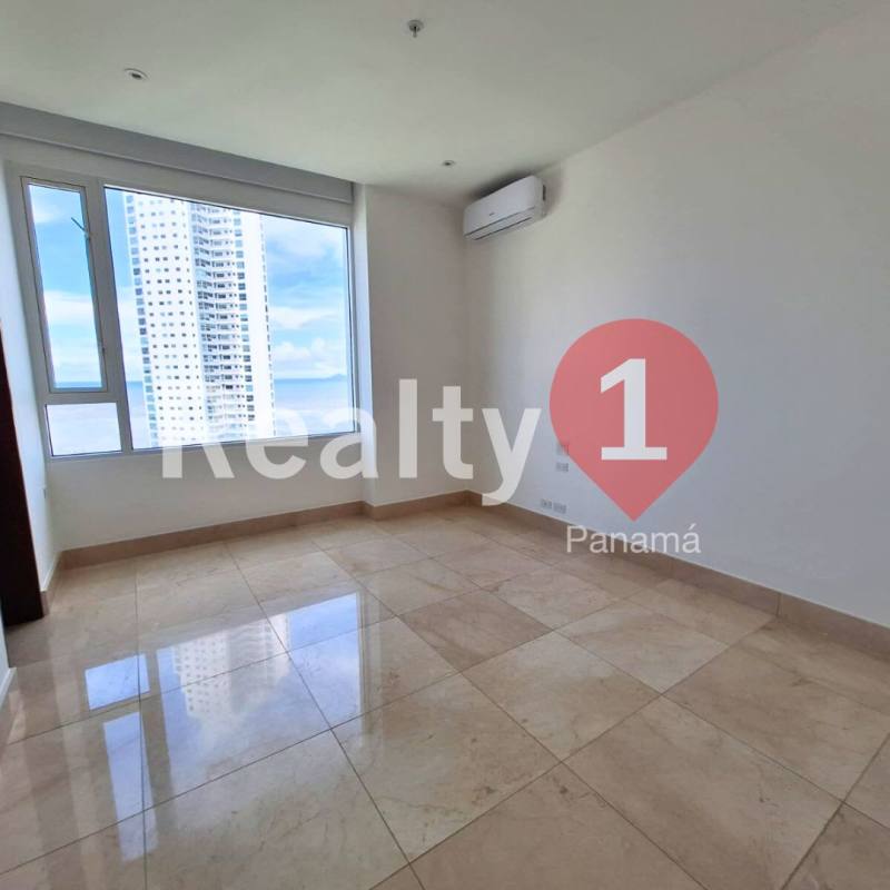 Sunny bedroom with ocean views, glossy tile floor and air conditioning at PH Aria Costa del Este