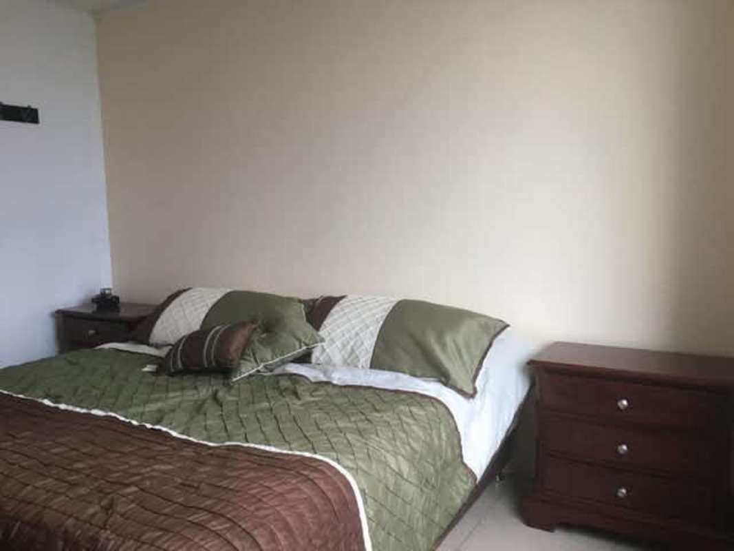 Modern living room with large windows and ocean view in PH Sol del Este Panama for sale