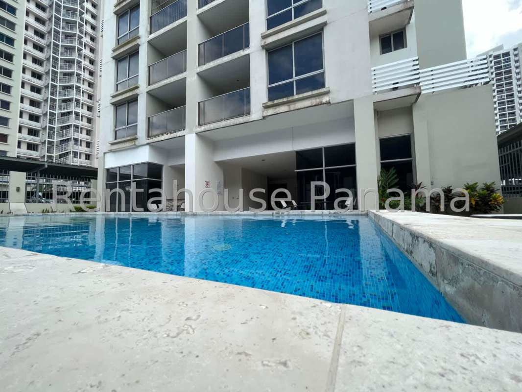 Large swimming pool with sun deck at PH Rokas Condado del Rey Panama City