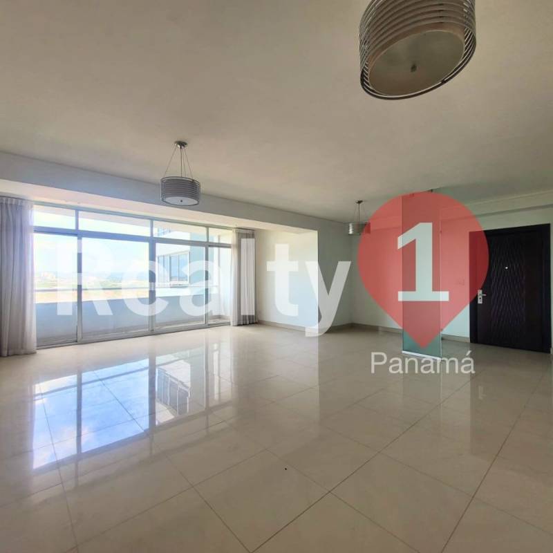 Bright master bedroom with large window overlooking skyline in PH Elevation Costa del Este Panama