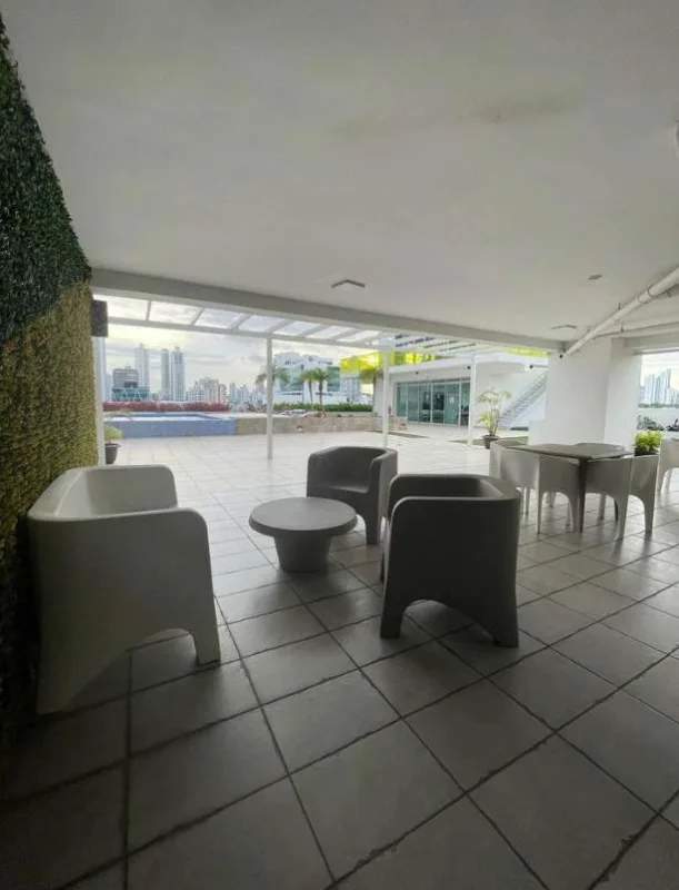 Balcony view with glass panels, skyline and safety net at PH Moon Tower in Panama City