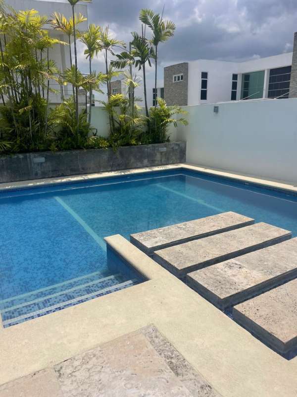 Contemporary swimming pool and lounge patio Costa Sur Panama City house