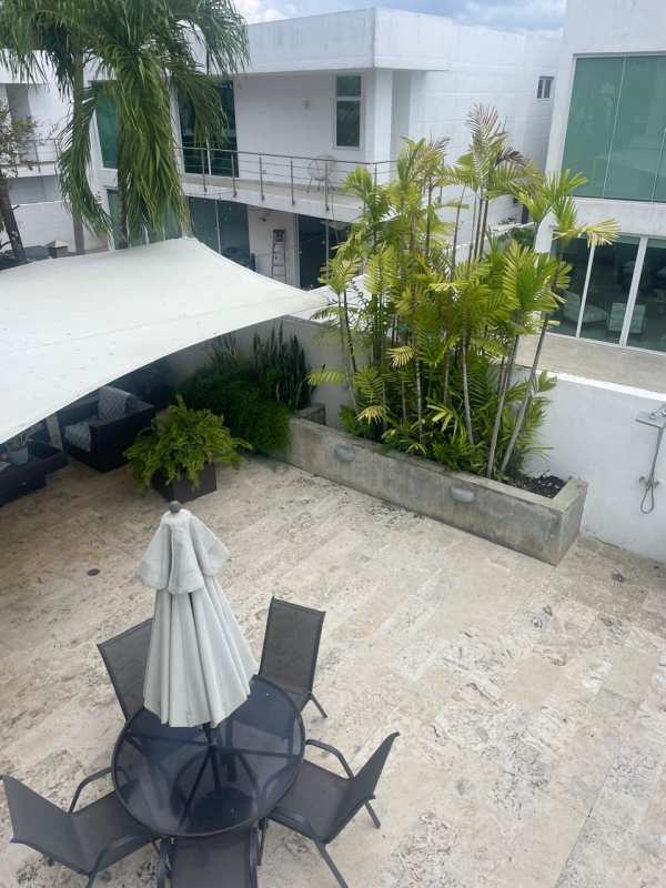 Modern patio with tropical landscaping in Costa Esmeralda Costa Sur house