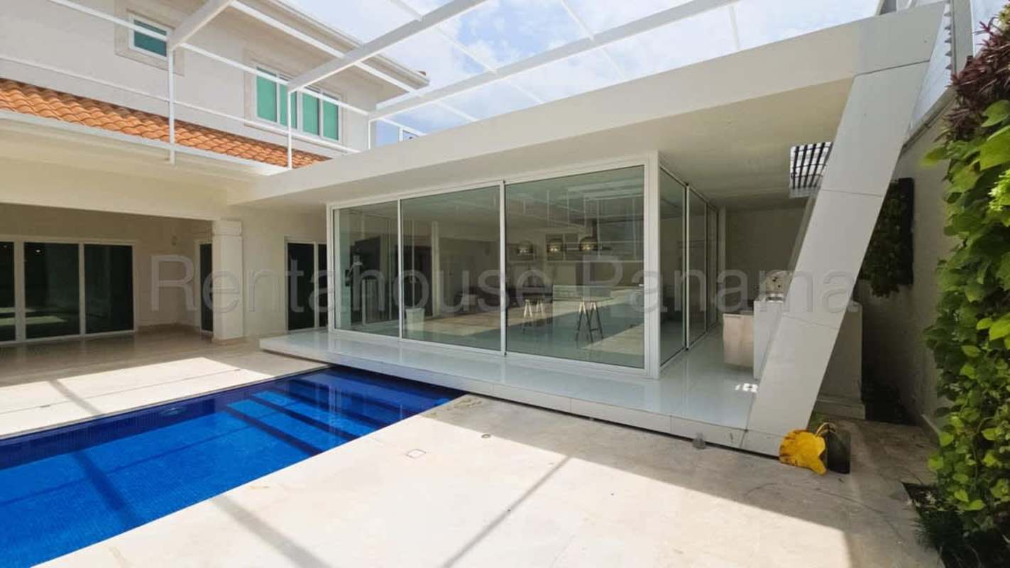Elegant living dining room marble floor sliding glass pool view luxury home Panama