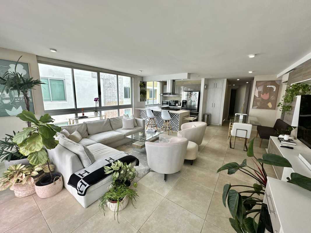 Open plan living and dining with balcony access, natural light and city views in PH Lumiere Panama