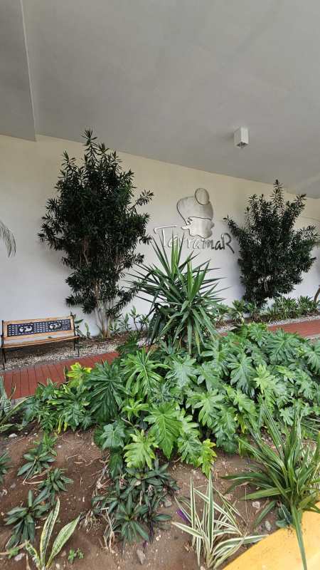 Covered walkway with landscaped gardens outside PH Terramar San Miguelito Panama