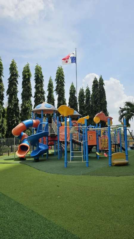 Living room dining area with large windows city views PH Terramar San Miguelito Panama